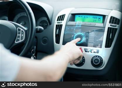 transportation and vehicle concept - man using car control panel