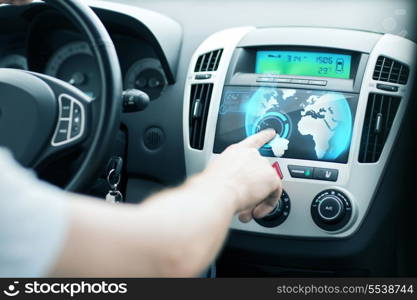 transportation and vehicle concept - man using car control panel