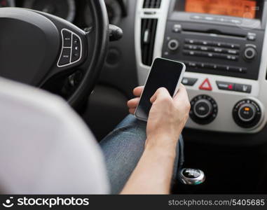 transportation and vehicle concept - man using phone while driving the car