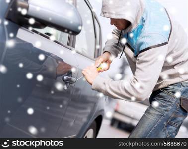transportation, crime, people and burglary concept - thief breaking car lock screwdriver