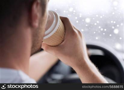 transportation, drinks, people and vehicle concept - close up of man drinking coffee while driving car