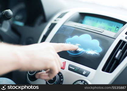 transportation, future technology and vehicle concept - man using car control panel