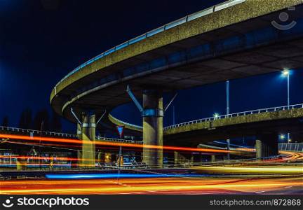 transportation highway system long exposure , urban sprawl interstate and interchange loops and turnarounds on highway.. transportation highway system long exposure , urban sprawl interstate and interchange loops and turnarounds on highway