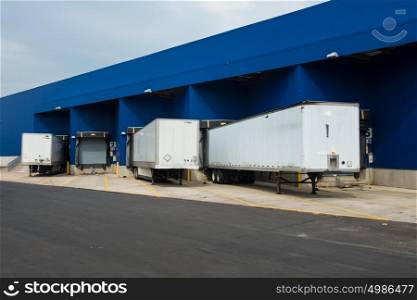 Transportation service delivery station. Big distribution warehouse with gates for loads and trucks