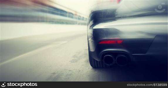 transportation, speed, racing and road concept - close up of car riding on highway from back