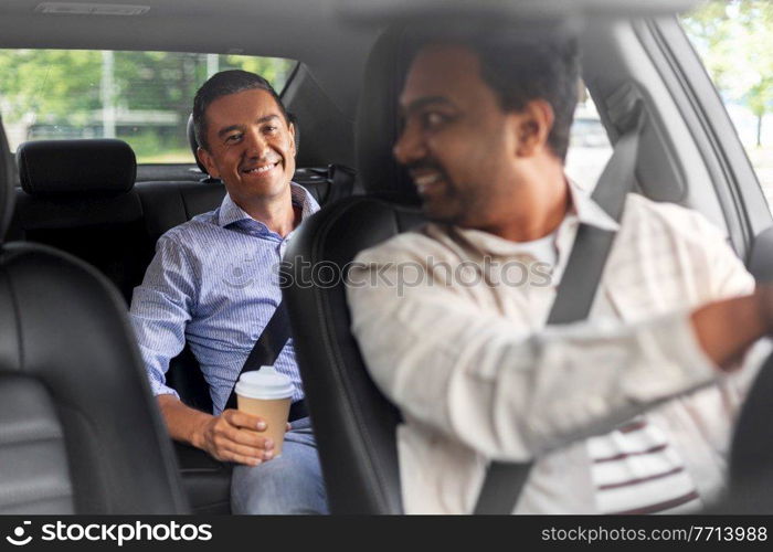 transportation, vehicle and people concept - happy smiling middle aged male passenger with coffee cup talking to taxi car driver. male passenger with coffee talking to car driver