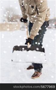transportation, winter, people and vehicle concept - closeup of man digging snow with shovel