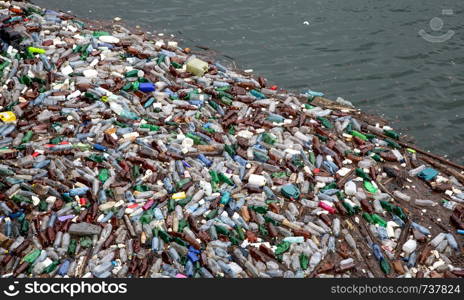 Trash and garbage floating on the surface of the water.