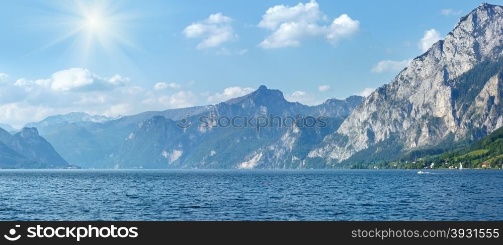 Traunsee summer lake panorama with sunshine in sky (Gmunden, Austria).