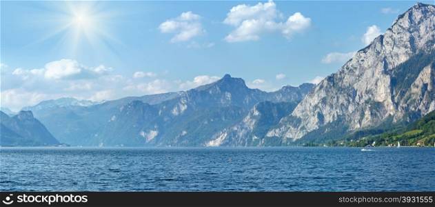 Traunsee summer lake panorama with sunshine in sky (Gmunden, Austria).