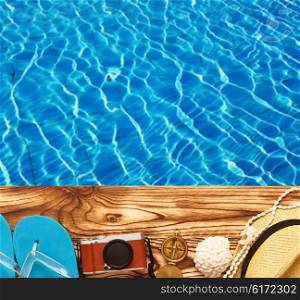 Travel and beach items at pool