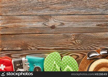 Travel and beach items still life over wooden background