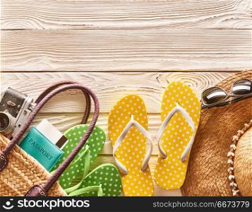 Travel and beach items still life. Travel and beach items still life over wooden background