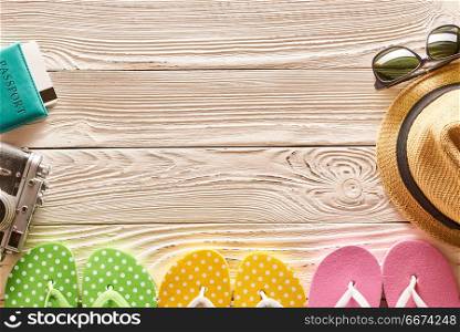 Travel and beach items still life. Travel and beach items still life over wooden background