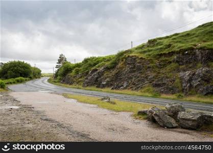 travel and countryside concept - asphalt road at connemara in ireland. asphalt road at connemara in ireland