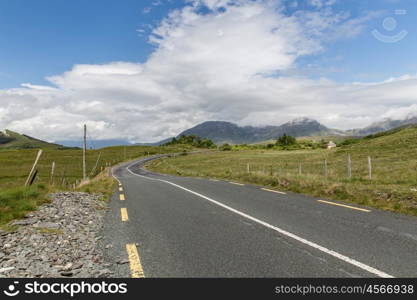 travel and countryside concept - asphalt road at connemara in ireland. asphalt road at connemara in ireland