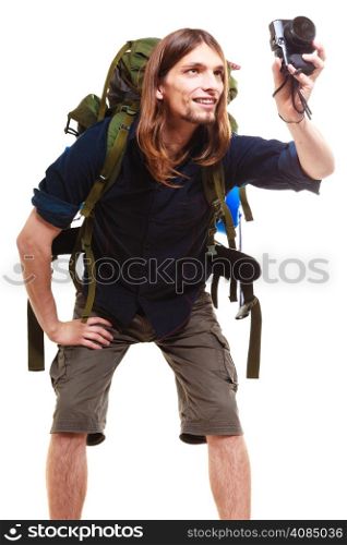Travel and tourism active lifestyle concept. Tourist male hiker with backpack and camera posing taking photo isolated on white