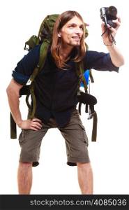 Travel and tourism active lifestyle concept. Tourist male hiker with backpack and camera posing taking photo isolated on white