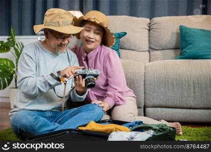 Travel and tourism. Happy mature retired couple photography weekend holiday, Asian couple old senior marry retired couple smiling taking photo by camera during luggage suitcase arranging for travel