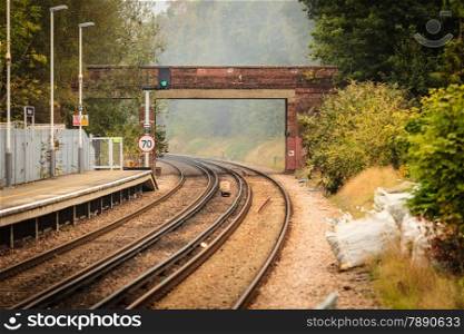 Travel and tourism. Rail road railway tracks. Foggy industrial landscape