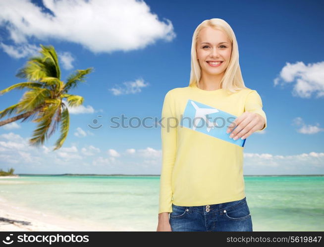 travel and transportation concept - smiling young woman with airplane ticket