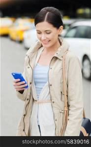 travel, business trip, people and tourism concept - smiling young woman with smartphone over taxi station or city street