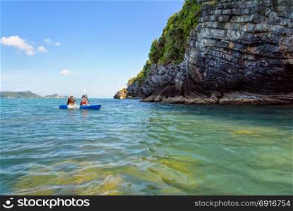 Travel by kayak. Two women are mother and daughter. Travel by boat with a kayak happy under the blue sky summer around Ko Phi view the beautiful nature of the sea and island, Mu Ko Ang Thong National Park, Surat Thani, Thailand