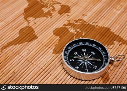 travel concept. black compass on the abstract world map