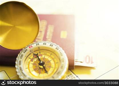 Travel concept. Golden compass and passport touristic maps on th. Travel concept. Golden compass and passport touristic maps on the desk. Travel background. Tourist essentials. Space for text. Vintage filtered color tone.
