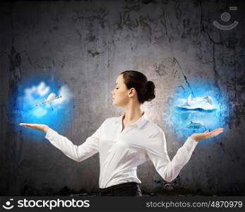 Travel concept. Image of businesswoman holding items in palms. Making choice