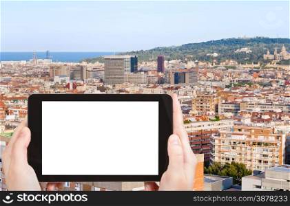 travel concept - tourist photograph Barcelona city and hill Montjuic, Spain in evening on tablet pc with cut out screen with blank place for advertising logo