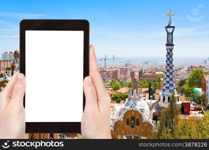 travel concept - tourist photograph Barcelona city, Spain on tablet pc with cut out screen with blank place for advertising logo