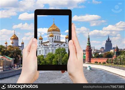 travel concept - tourist photographs picture of Cathedral of Christ the Saviour, Moscow on tablet pc