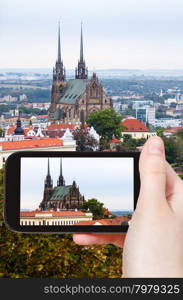 travel concept - tourist snapshot of Cathedral of St Peter and Paul in Brno city on smartphone