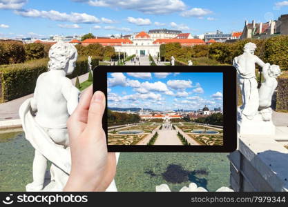 travel concept - tourist snapshot of fountain, garden and Lower Belvedere Palace in Vienna on tablet pc