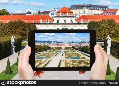 travel concept - tourist snapshot of garden and Lower Belvedere Palace in Vienna on tablet pc