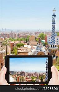 travel concept - tourist taking photo of Barcelona cityscape on mobile gadget, Spain