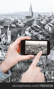 travel concept - tourist taking photo of Bern city on mobile gadget, Switzerland