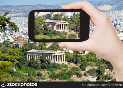 travel concept - tourist taking photo of temple in Athens on mobile gadget, Greece