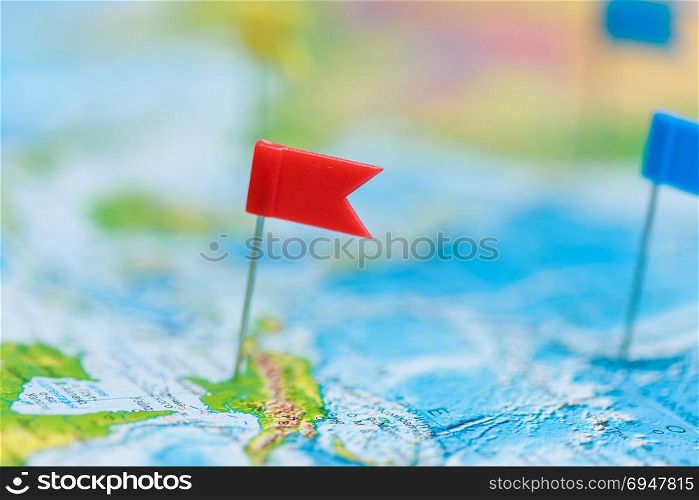 Travel concept with flag pushpins and world map. Travel concept with flag pushpins and world map.