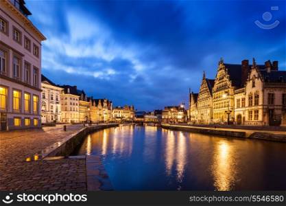 Travel Europe Belgium background - Ghent canal, Graslei and Korenlei streets in twlight the evening. Ghent, Belgium