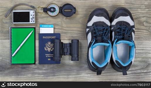 Travel gear basics on aged wooden surface