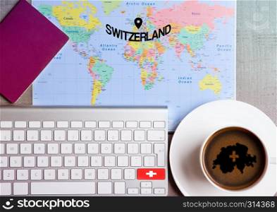 Travel holiday concept with coffee and map with flag on keyboard and passport on wooden table. Travel to Amsterdam Netherlands