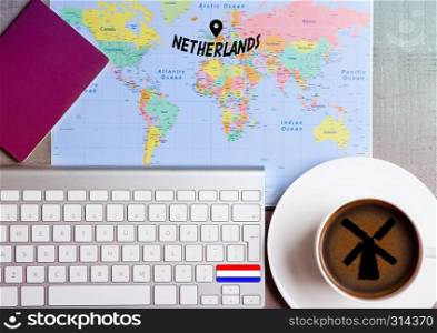 Travel holiday concept with coffee and map with flag on keyboard and passport on wooden table. Travel to Czech Republic
