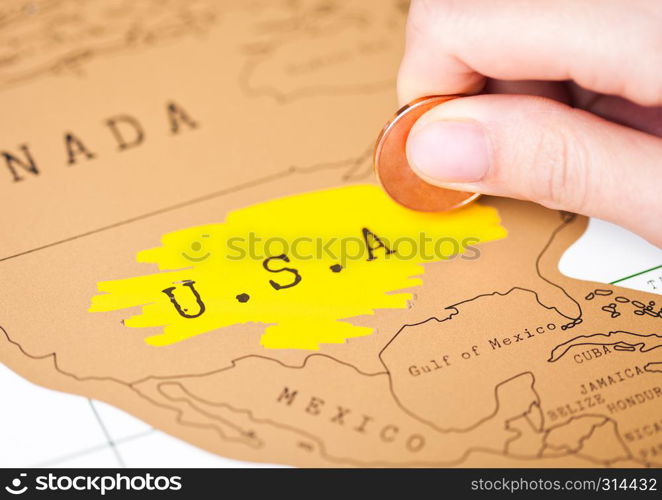 Travel holiday to United States of America concept with female hand scratching map choosing USA