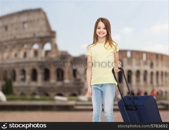 travel, holiday, vacation, childhood and transportation concept - smiling little girl with suitcase over coliseum background