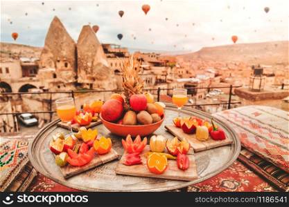 Travel in Cappadocia Colorful hot air balloons flying over the valley sunrise time with special breakfast travel destination in Turkey