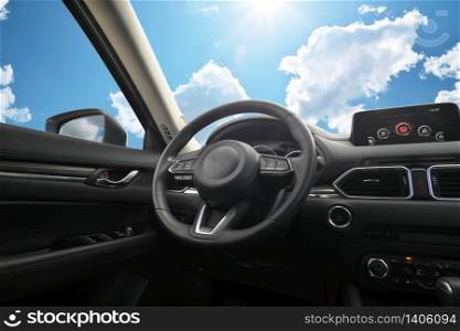 Travel in car. Element of design. Dashboard panel inside automobile and sky background. Behind the wheel.