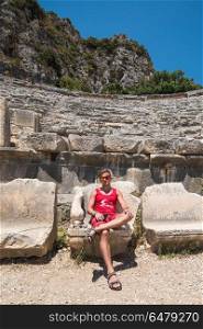 Travel in turkey. Young man at theatre in Myra ancient city of Antalya in Turkey.