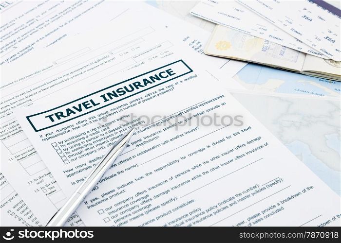 travel insurance form, passport and tickets on world map paperwork, concept and idea for insurance business